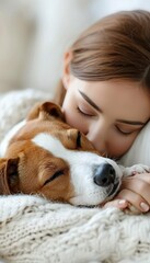 Obraz premium Young woman and dog peacefully sleeping together on a comfortable white bed in a cozy home setting