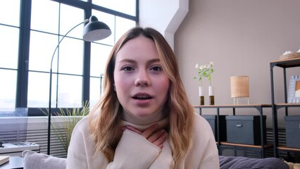 Amazed and surprised Caucasian woman talking to webcam during online video call and exclaiming wow at home. Remote communication and conversation.