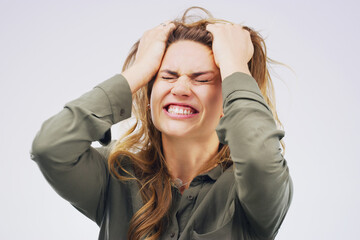 Woman, frustrated and pulling hair in studio for burnout, stress and mental health. Model, angry...