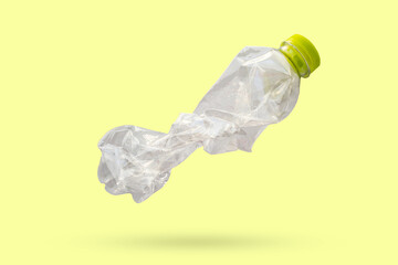 recycled plastic bottle isolated on green background - obrazy, fototapety, plakaty