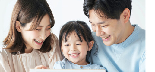 A Japanese family of three is smiling and looking at an iPad or tablet. Young child online learning and entertainment. Portrait of happy asian family spending time together family and home concept