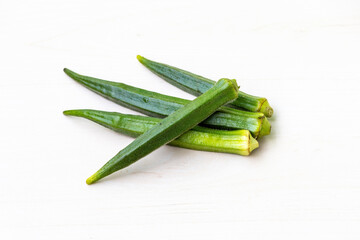 Okra or lady's finger isolated on a white background. Okra is beneficial for weight loss due to its low-calorie and high fiber content. 