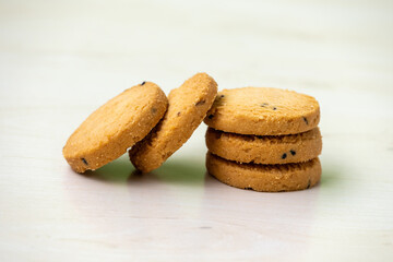 Delicious biscuits on a wooden background. Cumin cookies.