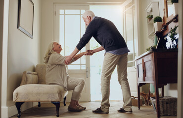 Elderly couple, home and support with help to stand by sofa for assistance, love and trust. Senior people, man and woman with mobility care in house for bonding, marriage and romance in retirement