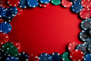 Top view, flat lay. Poker Chips on Red table