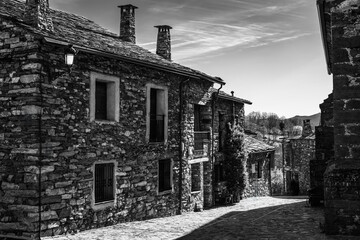 Old village with stone houses in the center of Guadalajara, Spain, black and white photo.