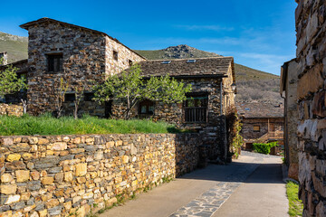 Picturesque streets with stone houses next to the mountains in Guadalajara, Valverde. - obrazy, fototapety, plakaty