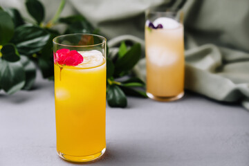 Refreshing tropical juice glasses on elegant table