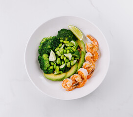 Healthy shrimp and greens salad plate
