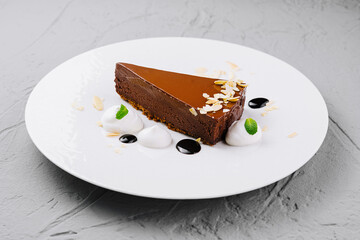 Gourmet chocolate tart on white plate