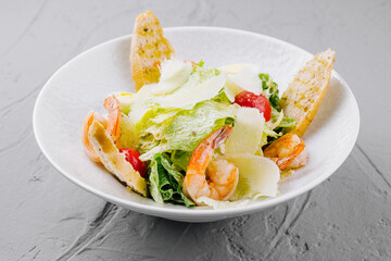Fresh shrimp caesar salad with parmesan and croutons