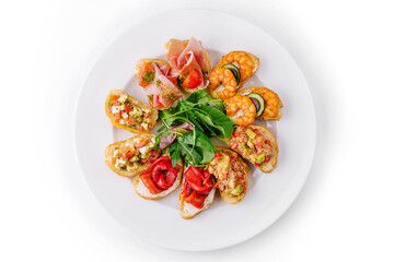 Gourmet bruschetta platter on white background