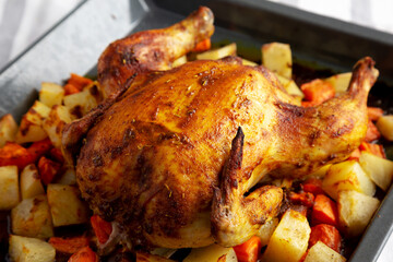 Homemade Hearty Roasted Chicken on a Tray, side view.