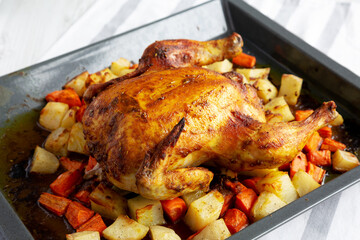 Homemade Hearty Roasted Chicken on Tray, side view. - 788247496