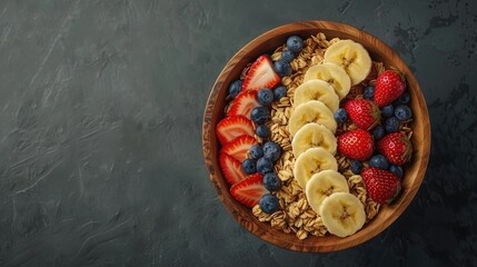 Wooden bowl with granola, strawberries and blueberries and banana slices. The background is dark gray. The photo was taken from above without perspective and close-up, - Powered by Adobe