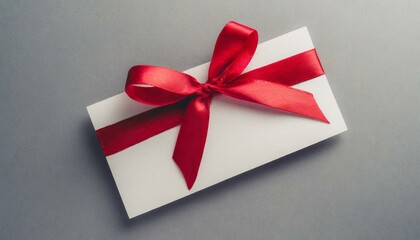 Blank white gift voucher with red ribbon bow or empty gift signboard isolated
