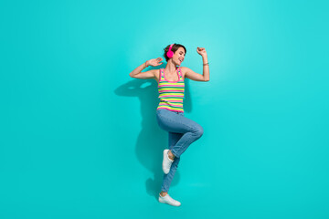 Fototapeta na wymiar Full body portrait of pretty positive lady listen favorite playlist dancing chilling isolated on turquoise color background