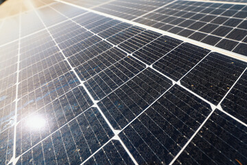 Green energy concept photo. Image with selective focus and camera movement. Solar panels on top of...
