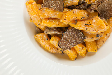 Truffle pastas. Close up photo with a gourmet dish made of truffles and other mushroom. Italian cuisine.