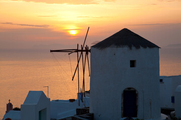 Windmill at sunset, Oia, Santorini, Cyclades islands, Greece