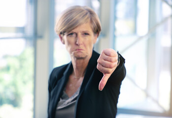 Portrait, thumbs down and business woman with hand, opinion or fail sign for problem in office....