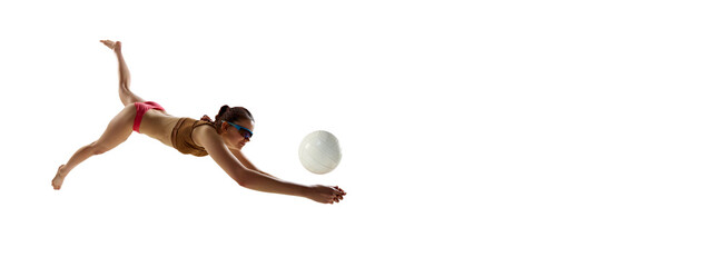 Banner. Young athlete woman, beach volleyball player passes ball in motion against white...