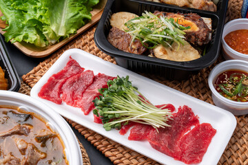 Korean food, Korean beef, beef sashimi,  beef sashimi, raw pork belly, charcoal fire, seasoning, ribs, side dishes, galbitang, rice, kimchi, ssamjang, chili peppers, garlic, radish sprouts, lettuce