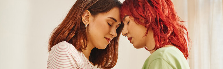 banner of serene young lesbian couple with closed eyes standing next to each other, bliss and love