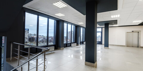 panorama view in empty modern hall with columns, doors, stairs and panoramic windows - 788298655