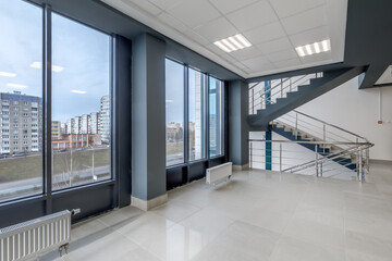panorama view in empty modern hall with columns, doors, stairs and panoramic windows - 788298661