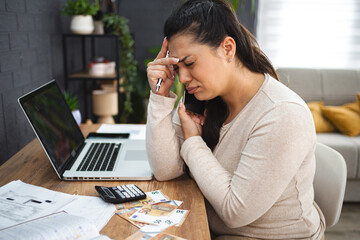Frustrated woman doing home finances
