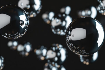 Shiny chrome spheres floating in the air on black background