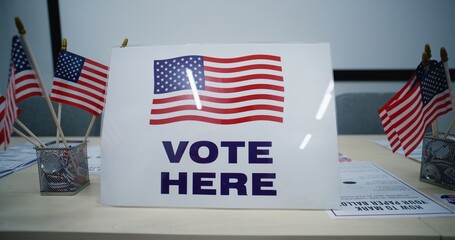 National Election Day in the United States of America. Sign with American flag logo standing on the...