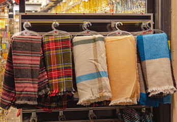 Colourful Fashion Wool Shawls Wraps Display at Hangers in Shop