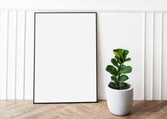 Picture frame mockup by a fiddle-leaf fig plant on a parquet floor