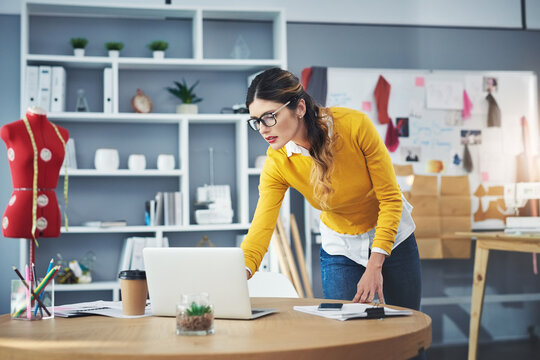 Woman, laptop and fashion or production design for creativity on textile website, small business or tailor. Female person, online and creative startup in studio or internet, retail or market research