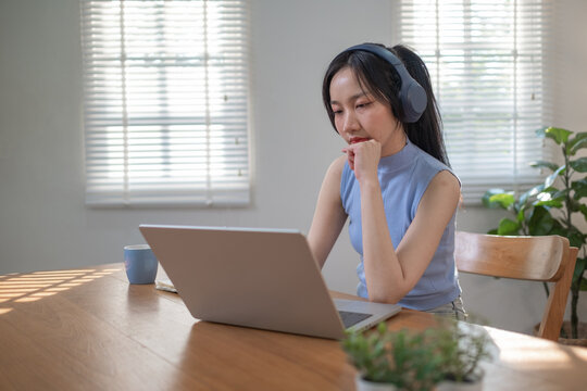 Teenager education learning online with technology, Education online, Study on internet, Young girl watching online lesson from computer at home