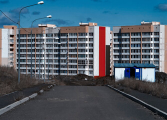 City street. Modern apartment buildings. New residential area. Contemporary architecture. Urbanization. Grunge urban landscape. Ust-Kamenogorsk (kazakhstan)