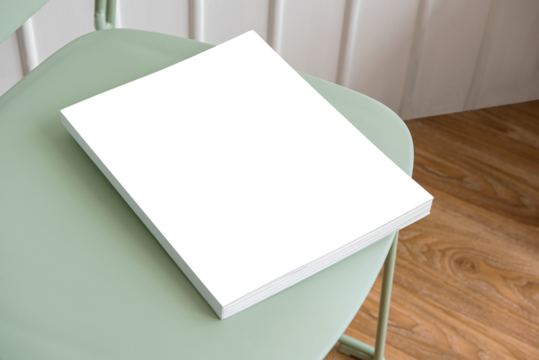 Book transparent png mockup on a pastel green chair
