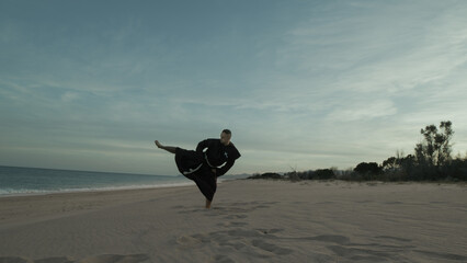 Karate Monk Closure Trains On The Beach Athlete