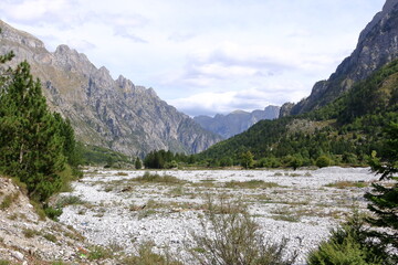 Fototapeta na wymiar Panoramic view of raw mountain landscapes from the Albanian Alps between Theth and Valbona, Albania