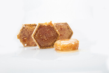 Honeycomb and honey dipper on white background. Isolated