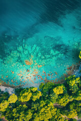 Fototapeta na wymiar Vertical Top view aerial photo from flying drone of an amazingly beautiful sea landscape with turquoise water.