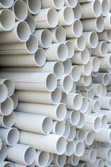 PVC pipes stacked in warehouse. High quality photo
