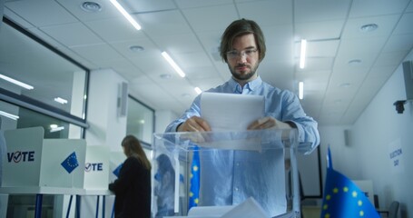 Multiethnic European people vote in voting booths at polling station during EU elections. Caucasian male voter puts ballot paper in box. Election Day in the European Union. Civic duty and democracy. - obrazy, fototapety, plakaty