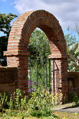 Naklejka premium brick archway to the church garden