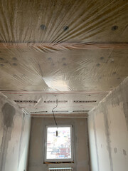 Insulation panels made of mineral wool, which were glued to the ceiling. Insulation and sound insulation of the room