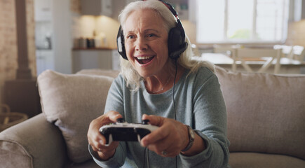 Headphones, senior woman and joystick for video game, online streaming and relax for retirement at home. Technology, elderly person and happiness with smile from esports, gaming and challenge on sofa