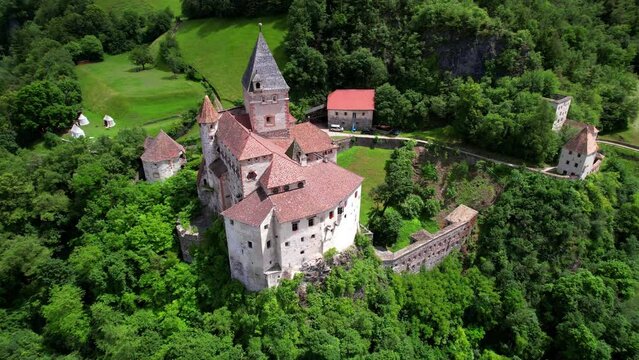 Historic medieval castles of northern Italy, Castel Forte or Trostburg, located in Isarco valley in South Tyrol. Aerial drone video
