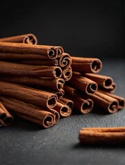 Cinnamon sticks on a black background.